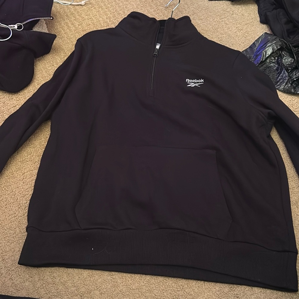New with tags Reebok black quarter zip never worn